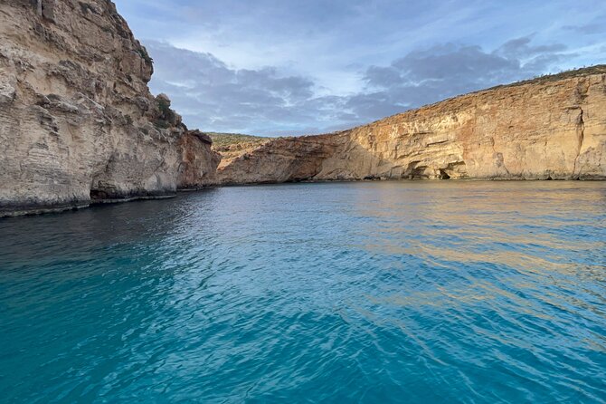 Blue Lagoon Ferry and Caves Tour - Getting to Mgarr Gozo and finding the blue umbrella