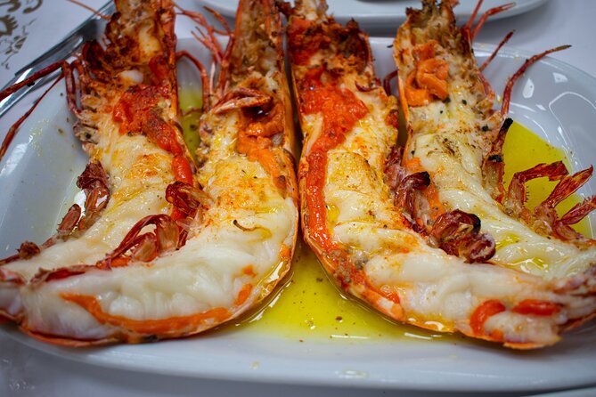 Food & Drink Private Tour in Lisbon & Cacilhas w/ Ferry Included - Sunset walking: Bridge 25 de Abril and the old fish factories