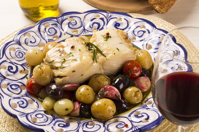 Food & Drink Private Tour in Lisbon & Cacilhas w/ Ferry Included - Almada petiscos stop: a cup of Portuguese wine with a view
