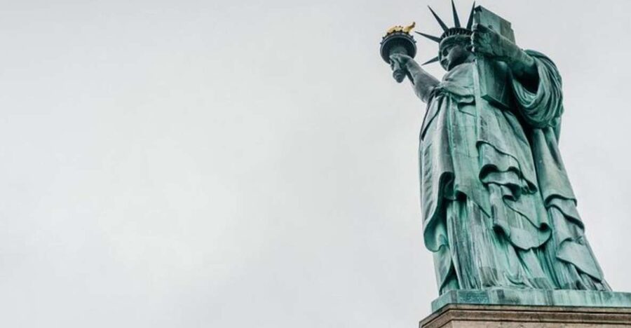 NYC: Statue of Liberty and Ellis Island Tour with Ferry - Ellis Island: Guided orientation vs. self-paced museum time