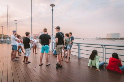 Riverside Walking Tour with Snack, Drinks & Local Ferry Ride - Getting Started at Mad Monkey and the quick tuk-tuk hop