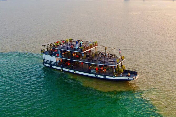 Riverside Walking Tour with Snack, Drinks & Local Ferry Ride - Royal Palace viewpoints while you stroll the river edge