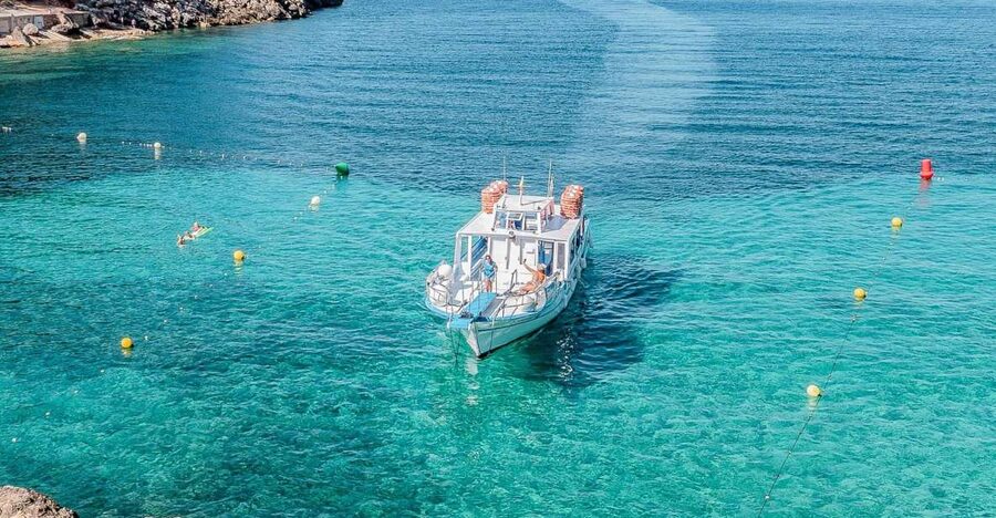 Sant Antoni: Round-Trip Ferry Transfer to Cala Salada Beach - First stop: Cala Salada’s pine shade, easy beach time, and a proper beach bar